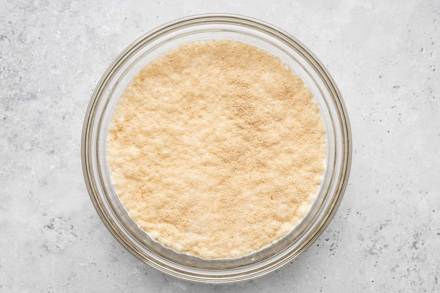 Blooming Yeast in a Bowl of Milk for How to Make Donuts