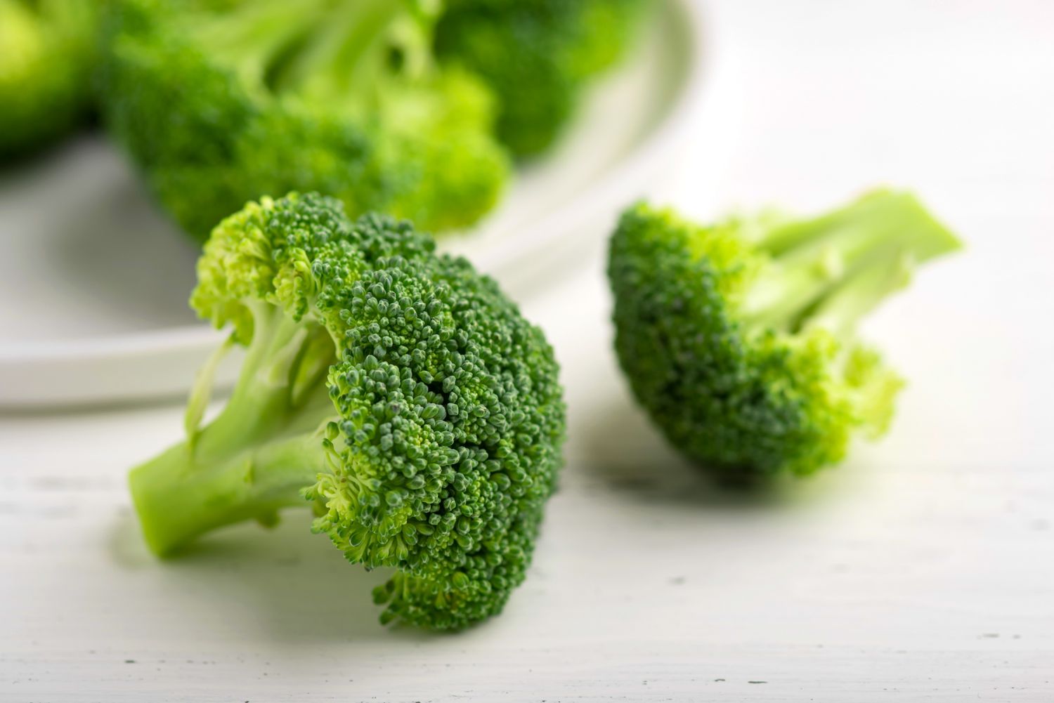 Broccoli florets on white background