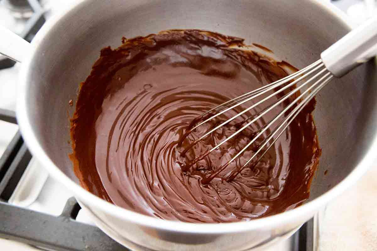 whisking melted chocolate in double boiler