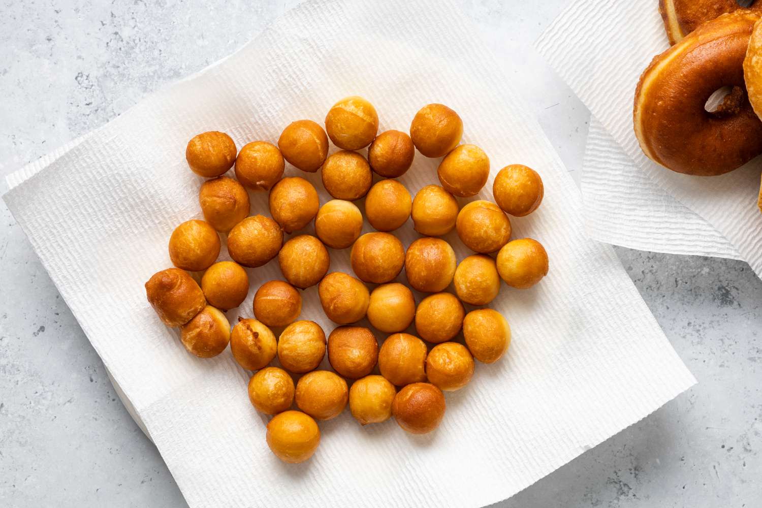 Donut Holes on a Paper Towel Lined Plate 