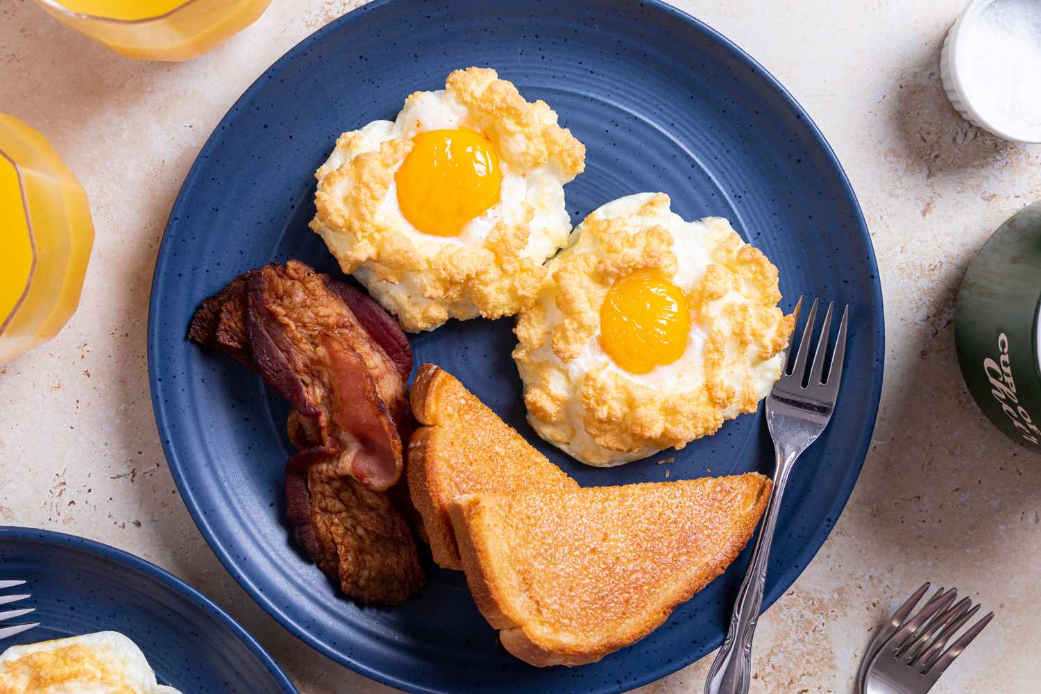 A breakfast plate of egg nests served on a table