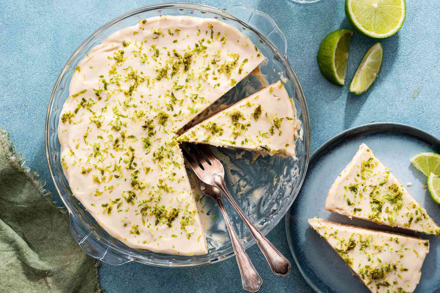 Easy lime icebox cake with two slices taken out on a blue plate with forks