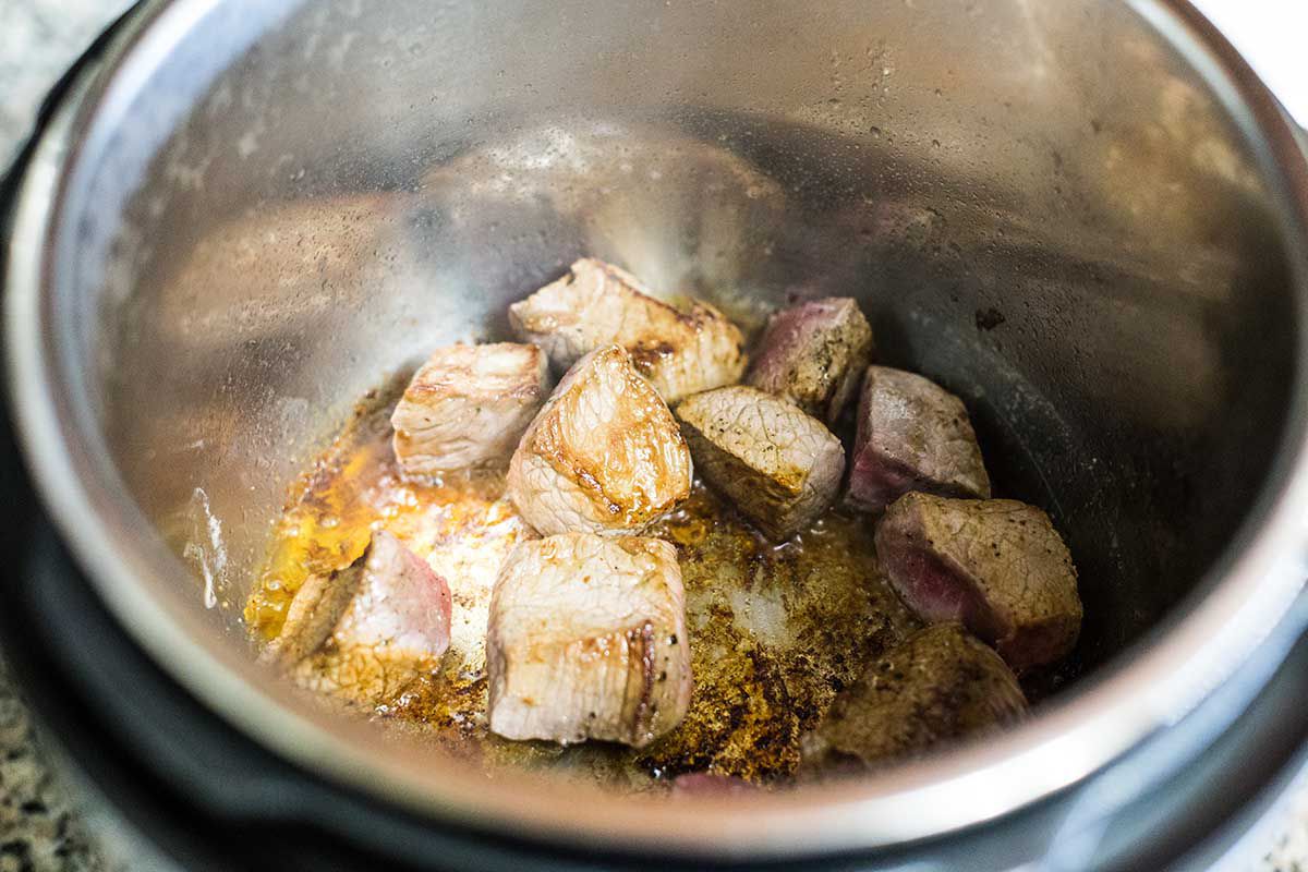 Brown the meat for Irish beef stew on all sides