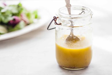 Homemade Honey Mustard Dressing - ball jar with honey mustard dressing wtih silver spoon