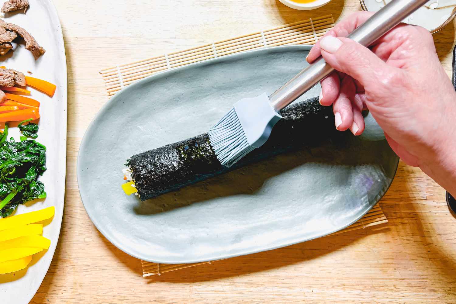 Brush Classic Kimbap with Sesame Oil Using Pastry Brush