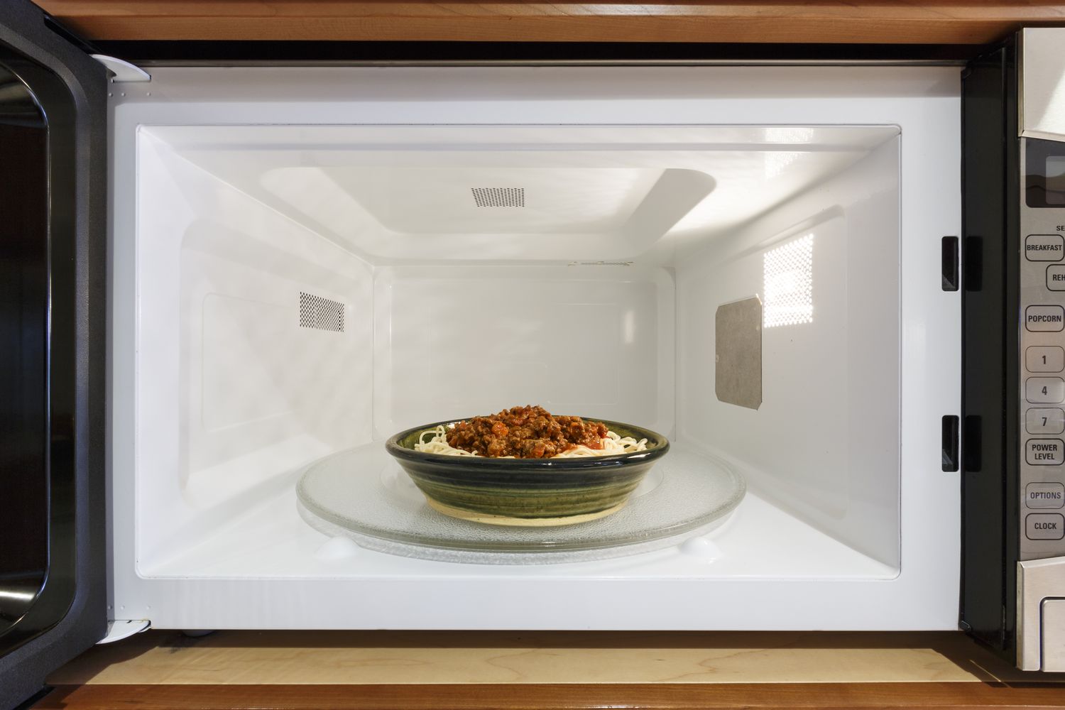 Bowl of pasta and sauce in a microwave oven