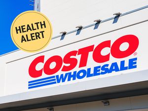 Costco Wholesale sign with Health Alert label over the image