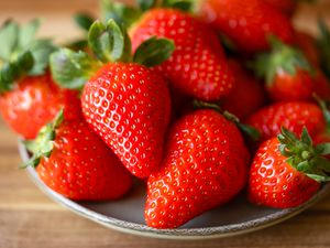 A plate with fresh strawberries