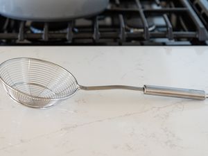 Spider strainer on a counter 