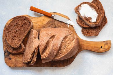Homemade dark rye bread on a wooden board