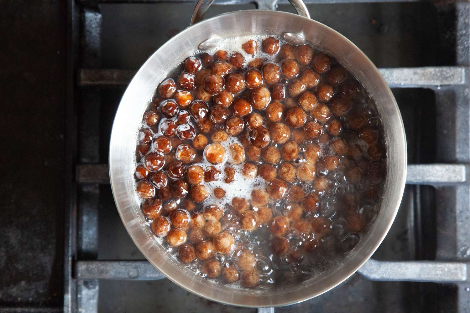 Tapioca Pearls Boiling in a Sauce Pan on the Stove for How to Make Boba Tea Recipe