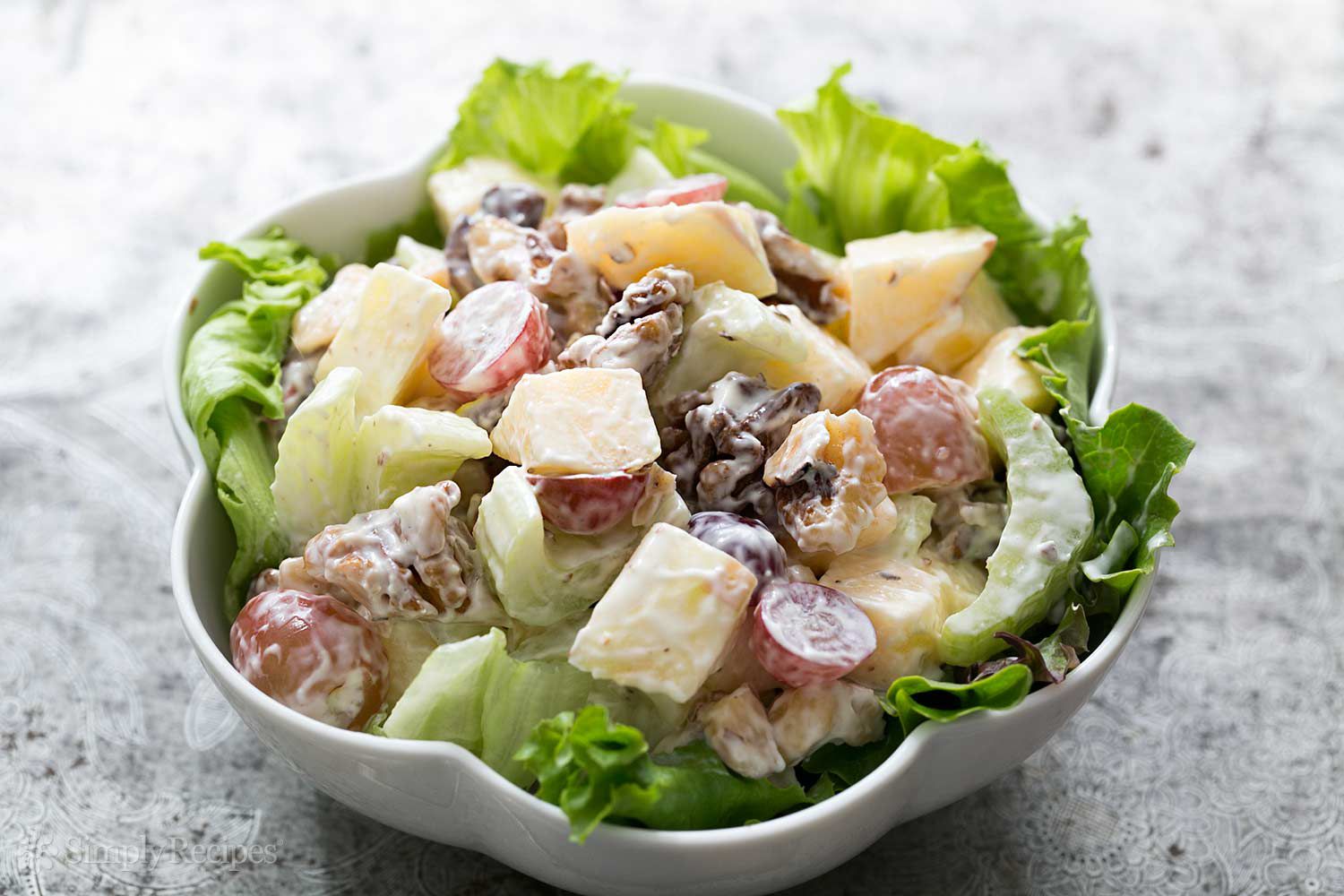 A Waldorf Salad in a white bowl 