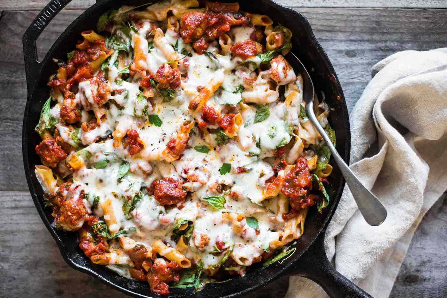 Pasta Skillet with Chicken Sausage, Cheese and Spinach in a cast iron skillet