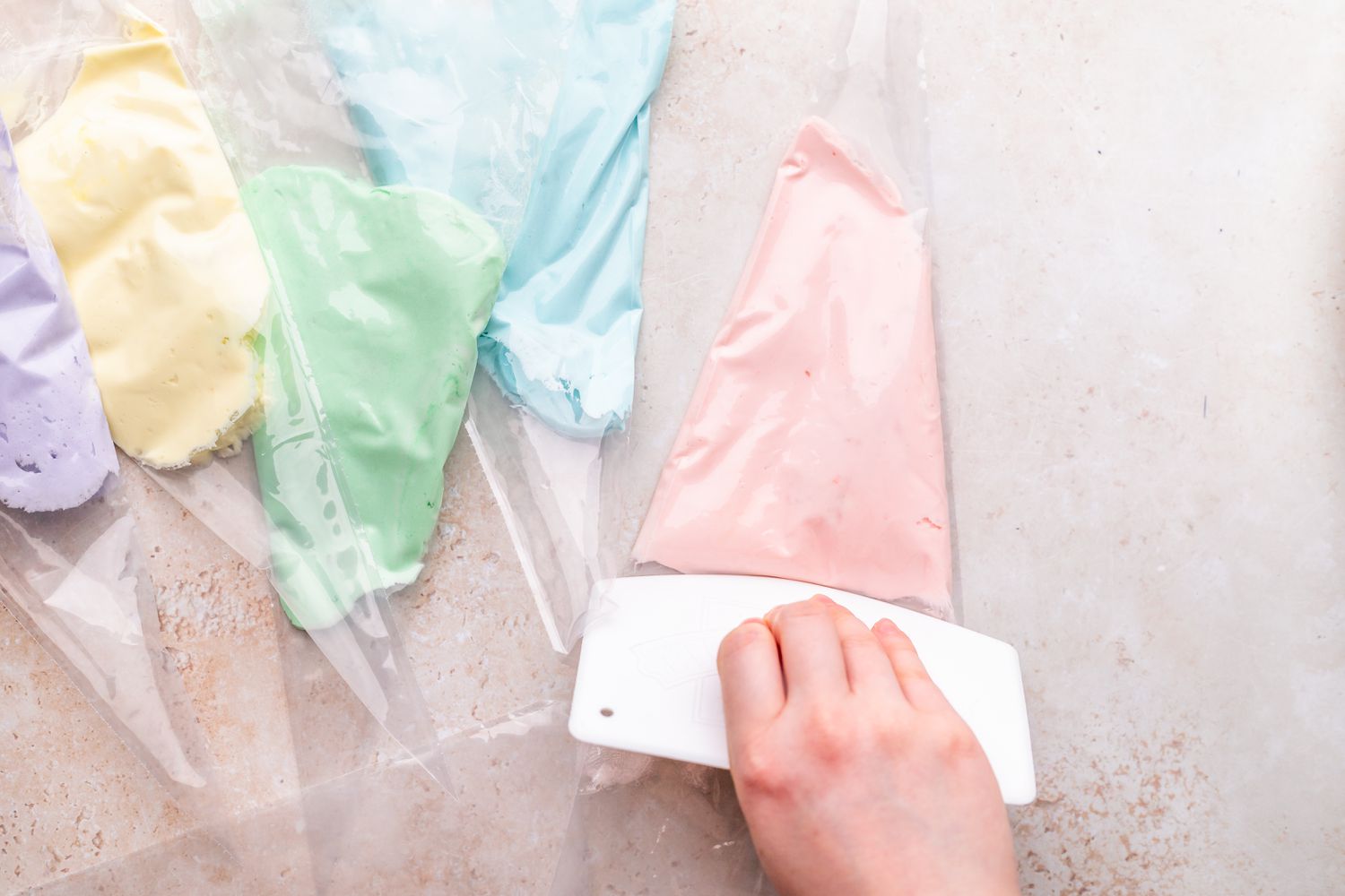 Fill Buttercream into Separate Piping Bags for Unicorn Cake 