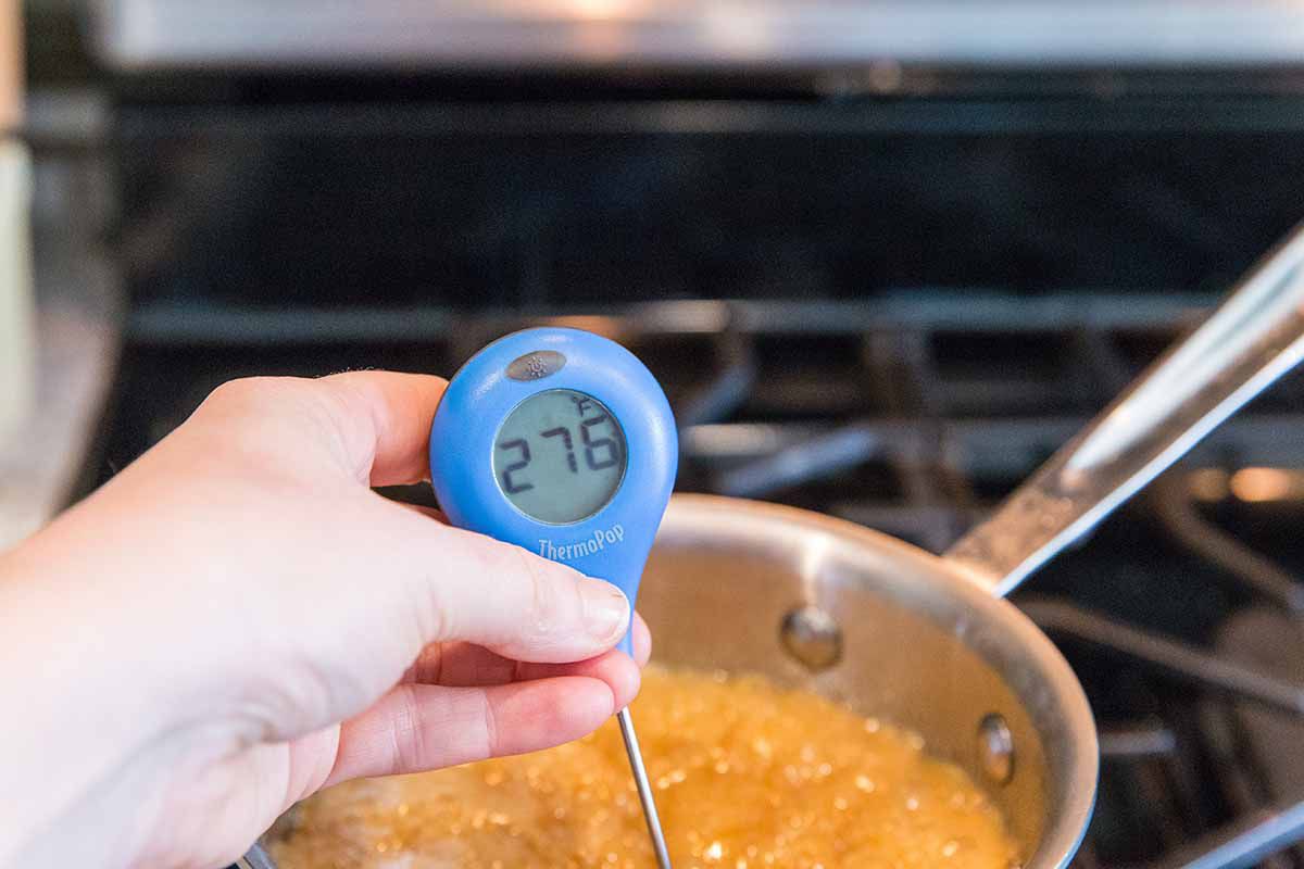 Chocolate Matzo Toffee Recipe - - taking the temperature of the toffee with a candy thermometer