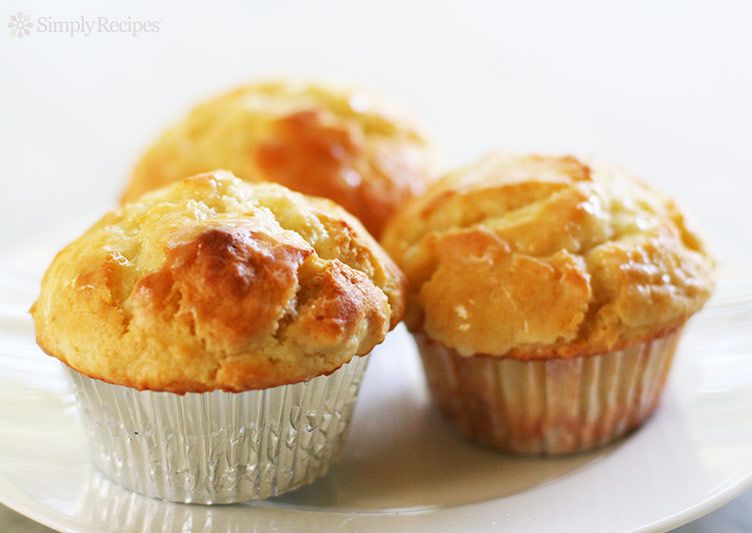 Three Lemon Ginger Muffins on a white plate.