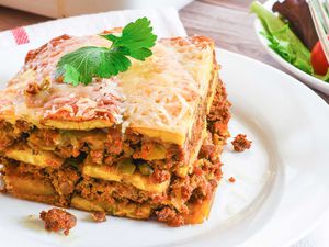 A slice of Pastelon Puerto Rican Plantain Lasagna on a plate