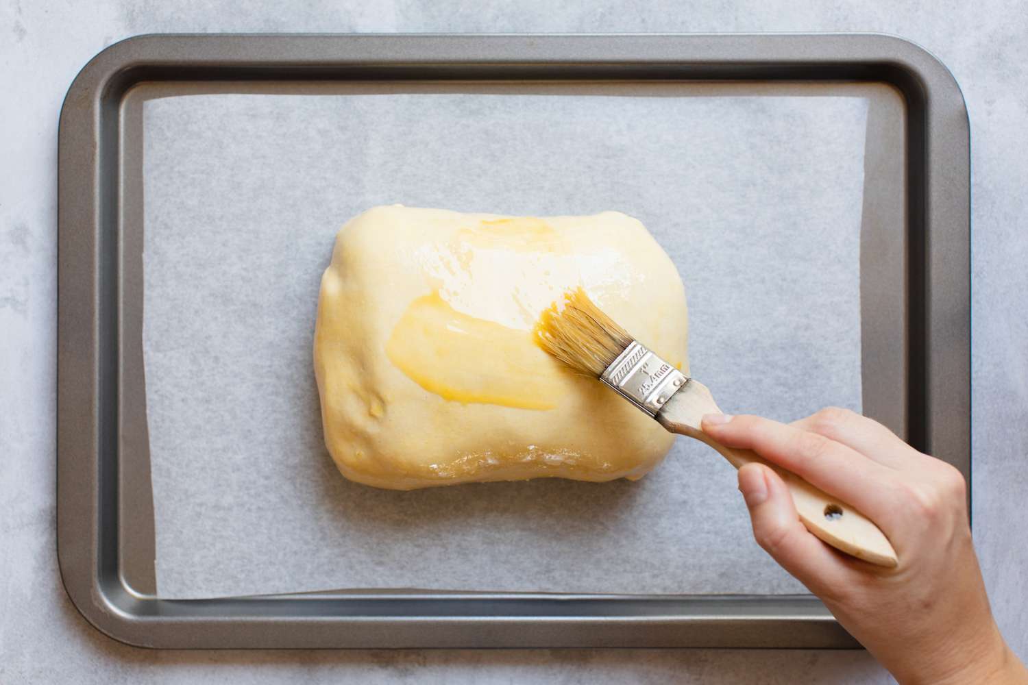 On a Lined Baking Pan, Beef Wellington Brushed with Egg Wash