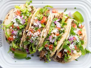 Instant Pot Pulled Pork Carnitas Tacos on a serving tray