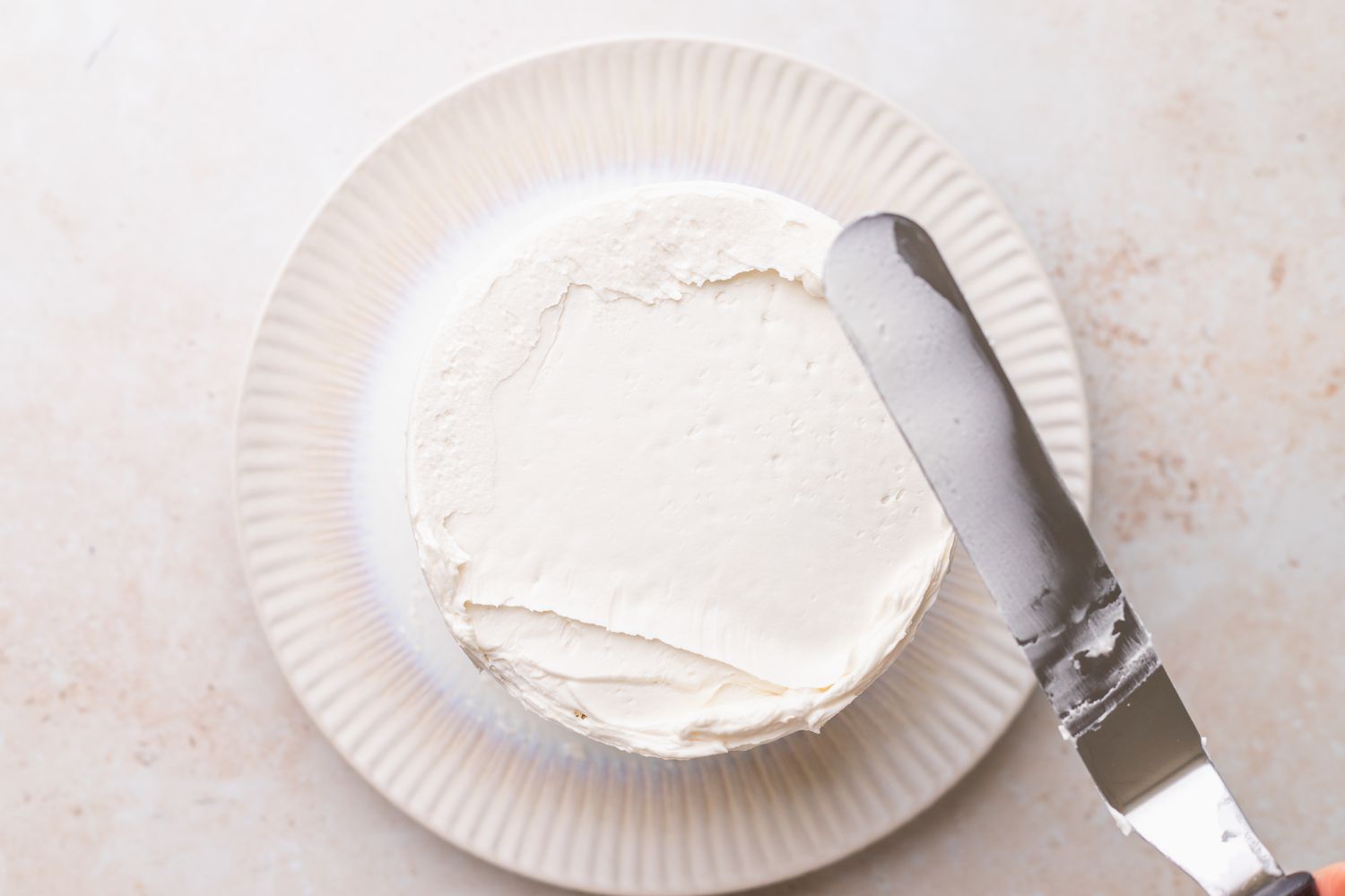 Icing Added to Unicorn Cake Using Off-Set Spatula 