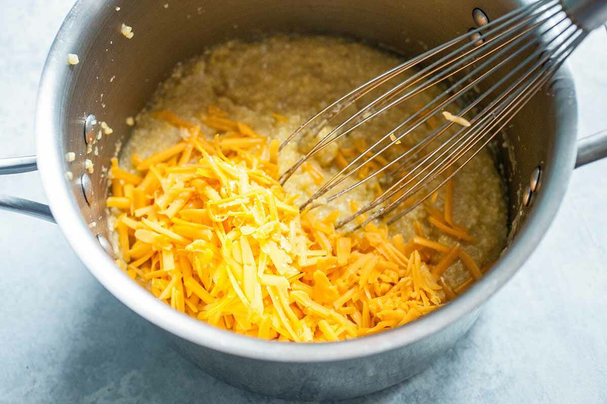 Add the cheese to the polenta in the saucepan