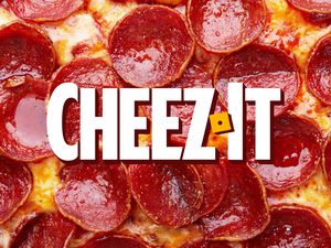 Pizza topped with pepperoni with Cheez-It logo in the center