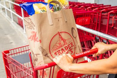 Trader Joe's grocery bag on a red cart