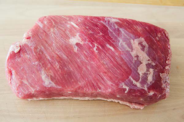 Raw Cut of Corned Beef Fat side down