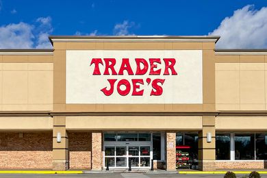 The storefront of Trader Joe's with its recognizable red-lettered sign