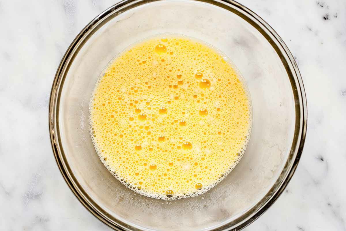 Eggs that have been whisked and frothed in a bowl