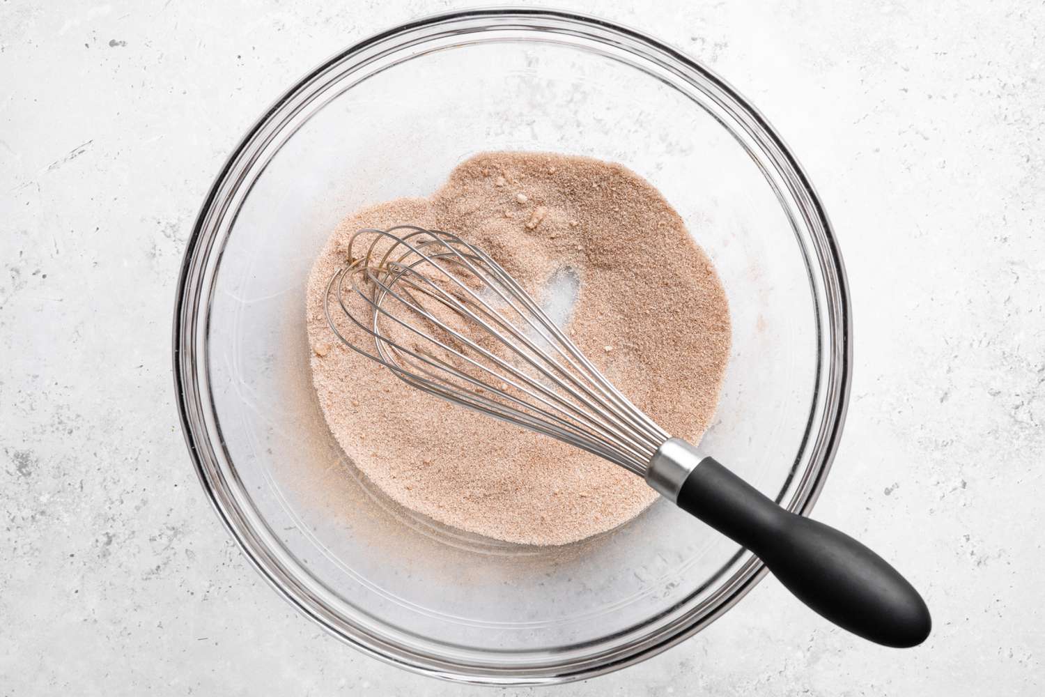 Cinnamon and Sugar Whisked Together in a Bowl for Monkey Bread Recipe