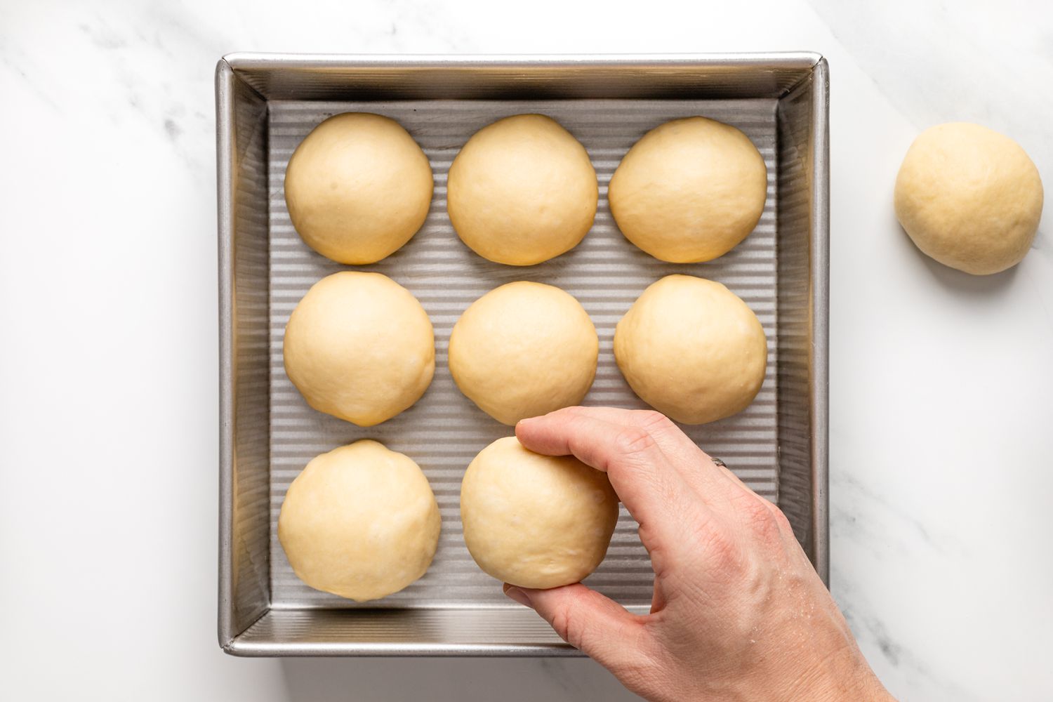 Place rolled dough into cake pan