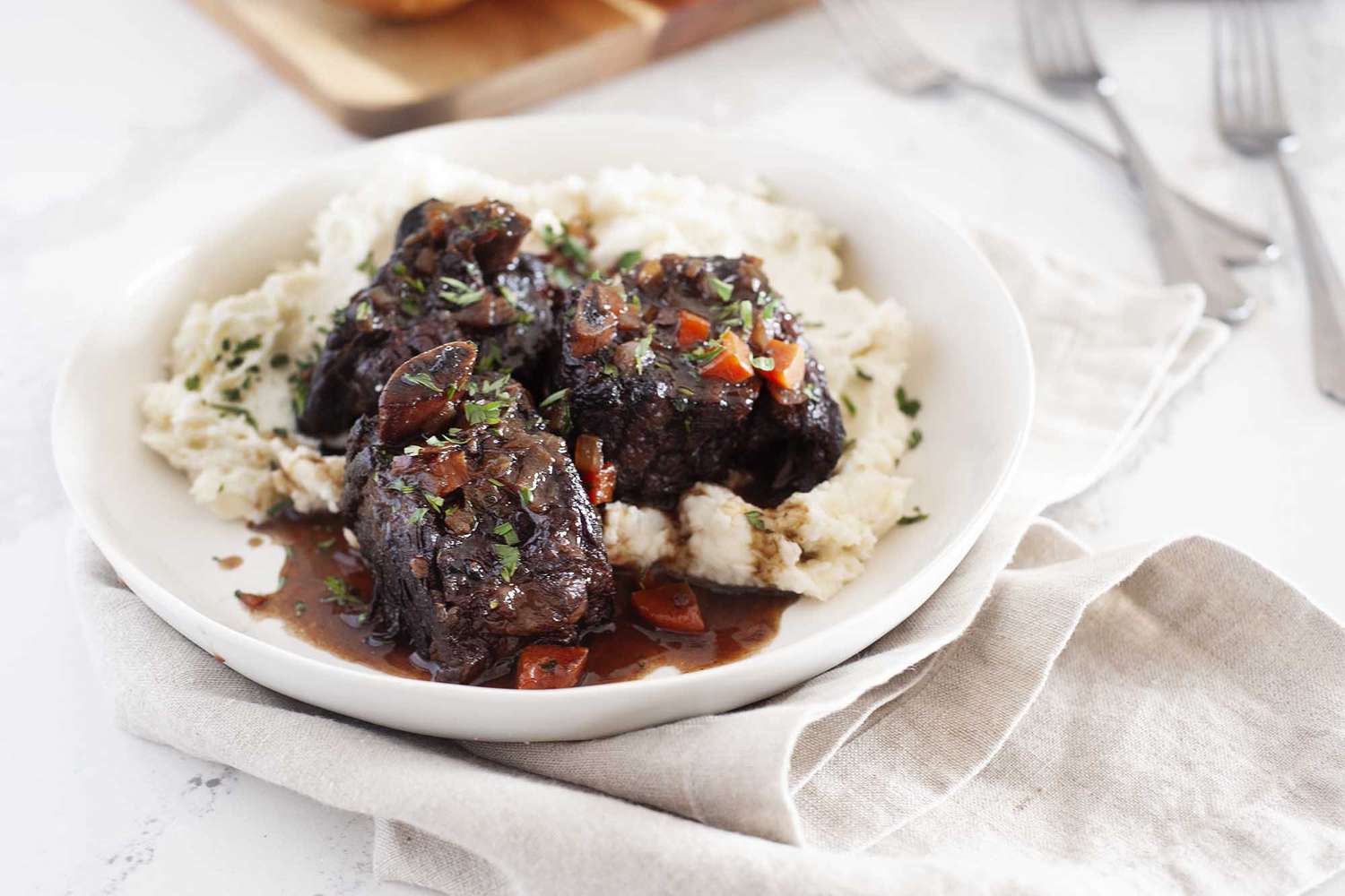 Rice and short ribs on a plate.