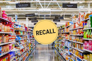 Looking down a grocery store aisle. A "recall" badge is superimposed over the center of the photo.