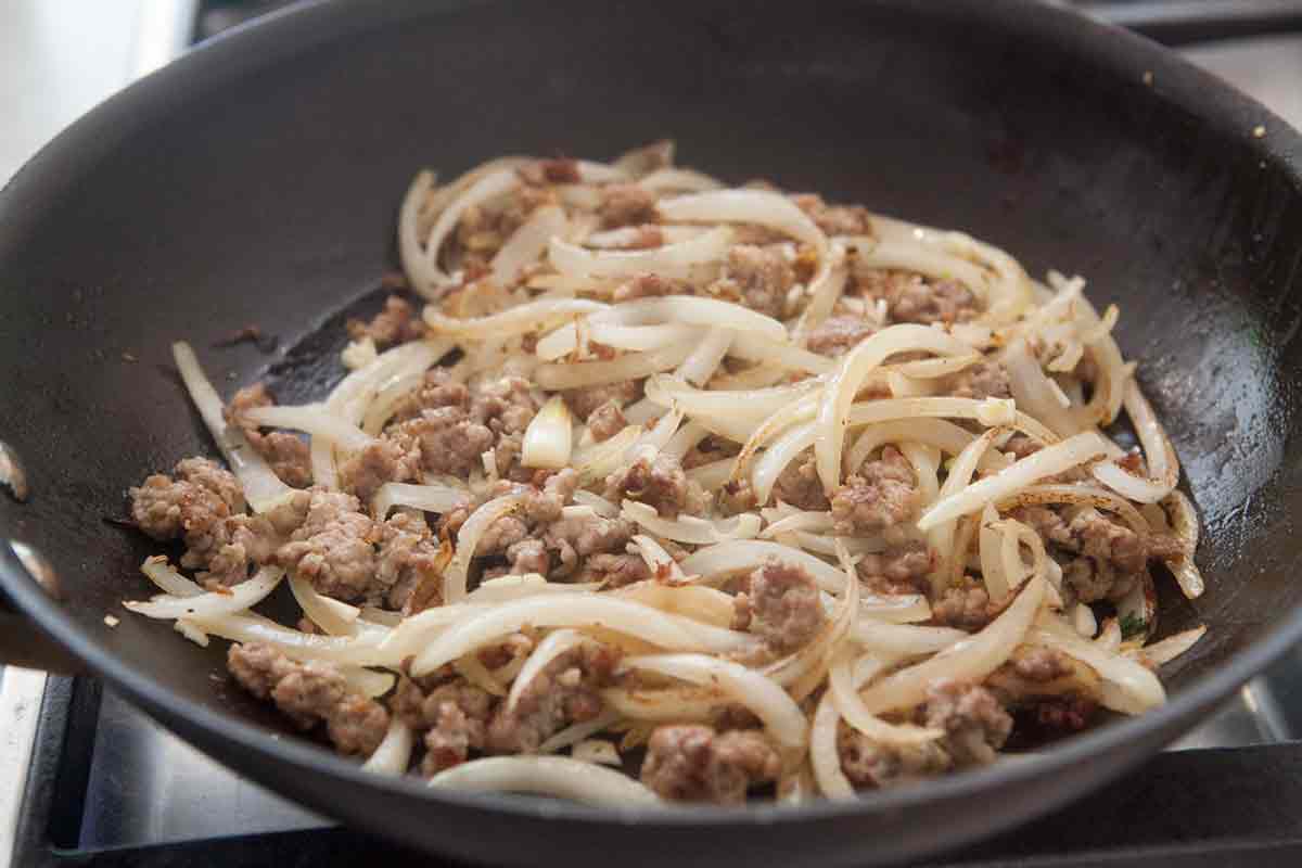 sautéing onions and sausage