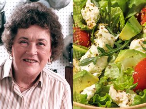 Julia Child next to a bowl of salad with vegetables