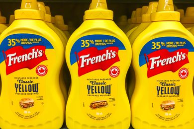 French's Yellow Mustard bottles on a store shelf