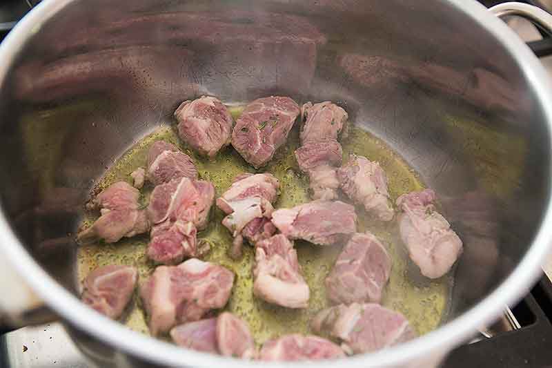 Raw Lamb Stew Pieces Marinating in bowl