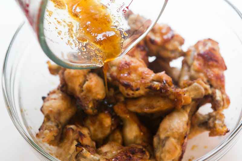 honey wings tossed with remaining ginger honey marinade