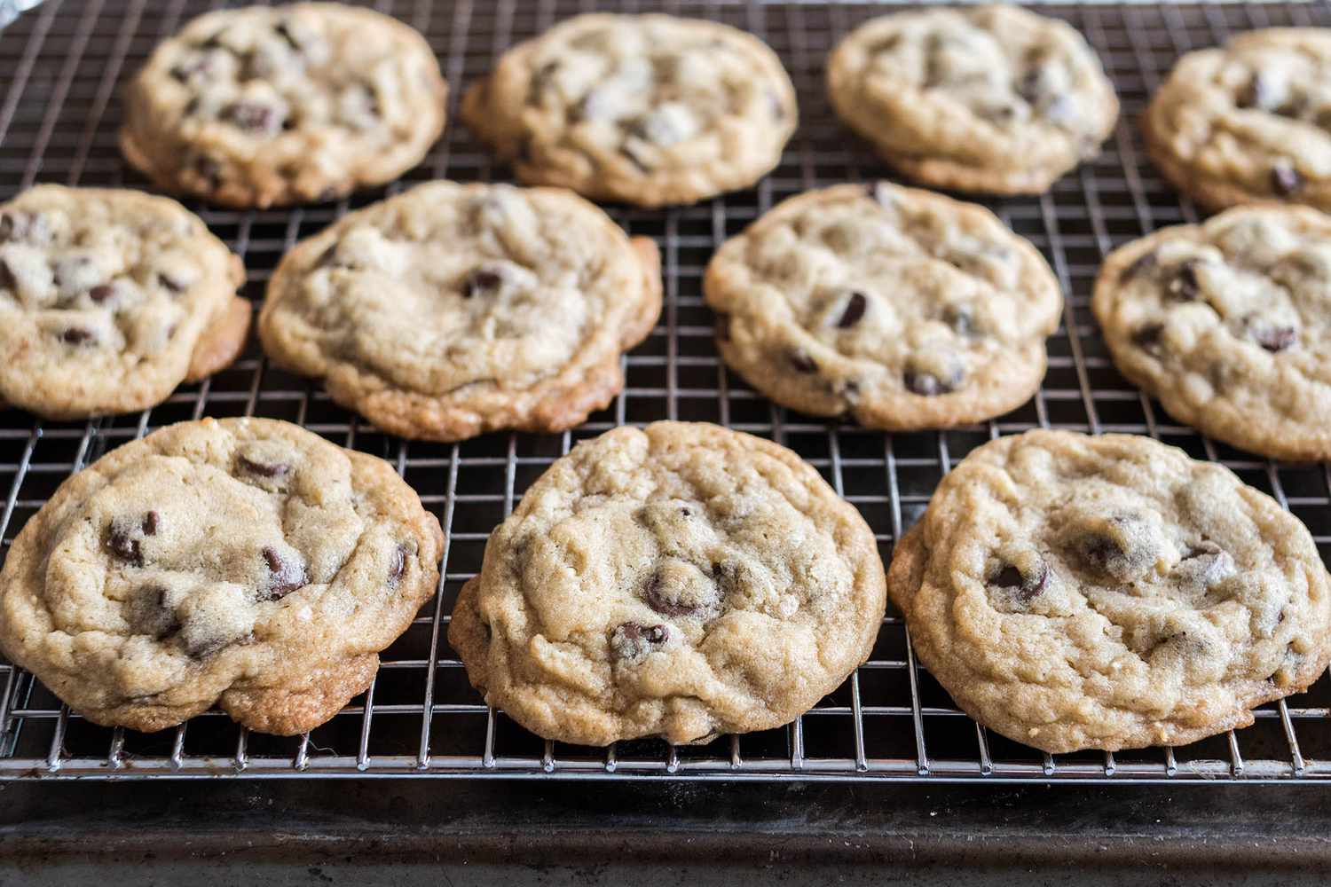Cookies cooling on a rack for an easy chocolate chip cookie recipe.