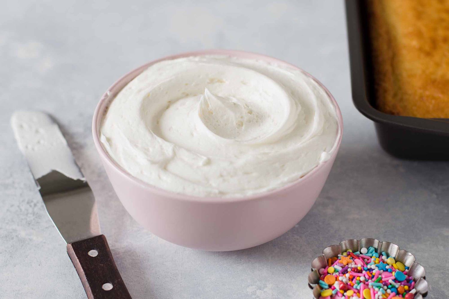 Best Buttercream frosting - white frosting in a pink bowl