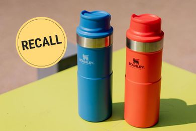 A red and a blue Stanley mug with a "Recall" badge