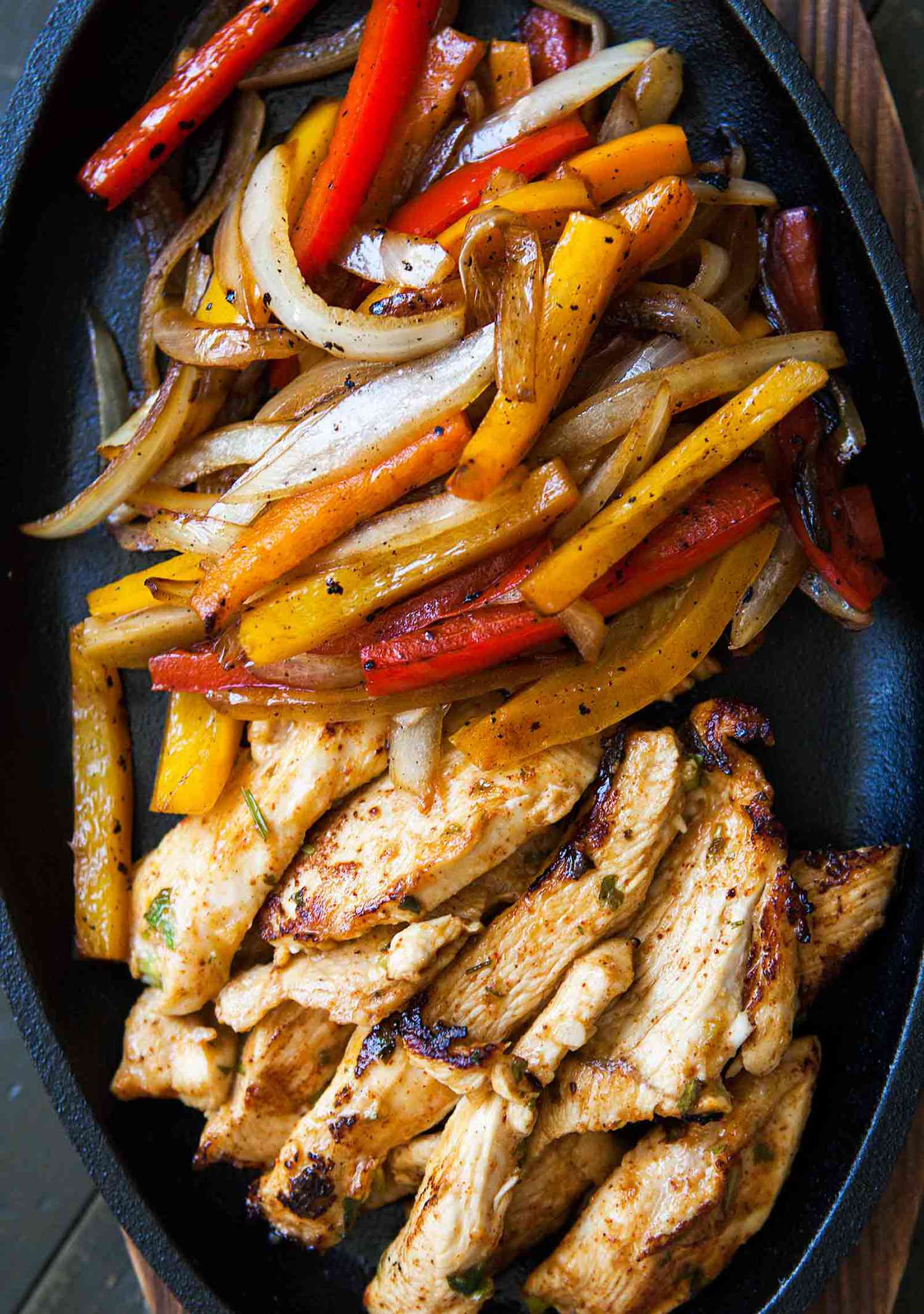 Chicken Fajitas resting in a cast iron platter