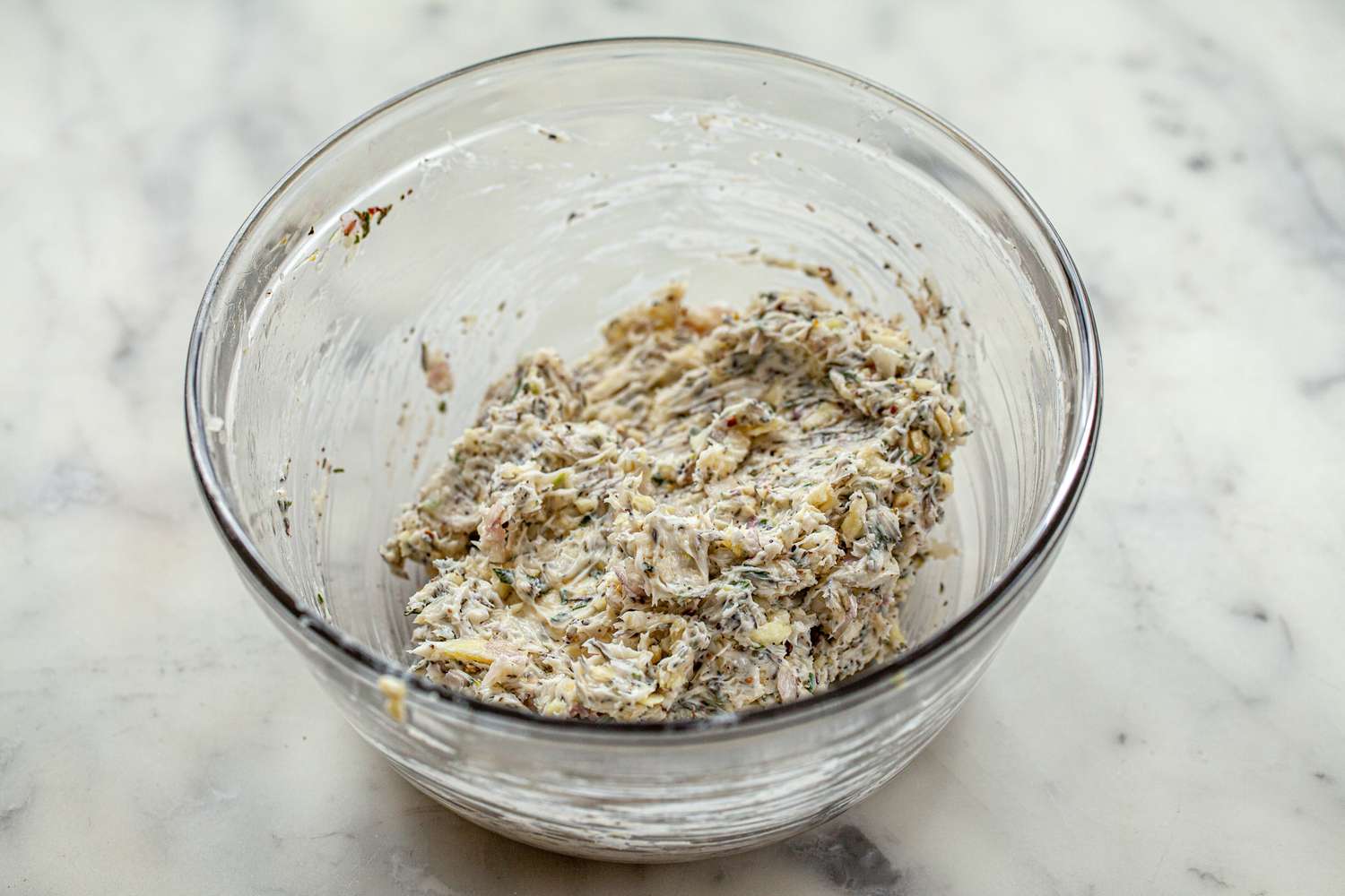 Herb butter in a bowl for a Rosemary and Thyme Prime Rib.
