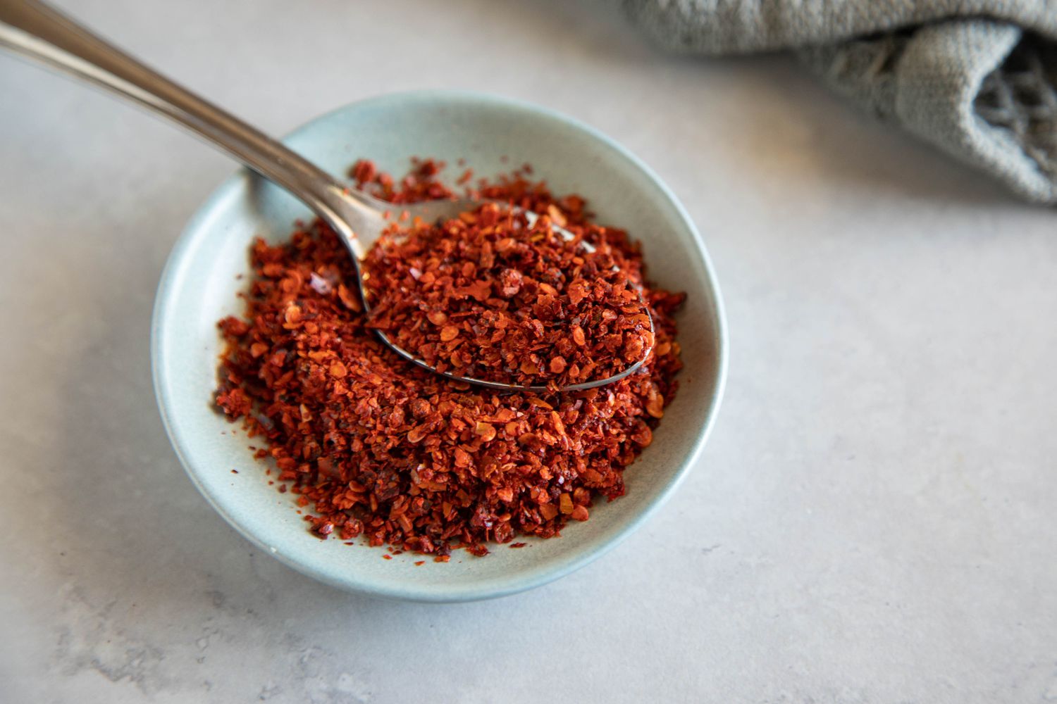 Aleppo pepper in a blue bowl