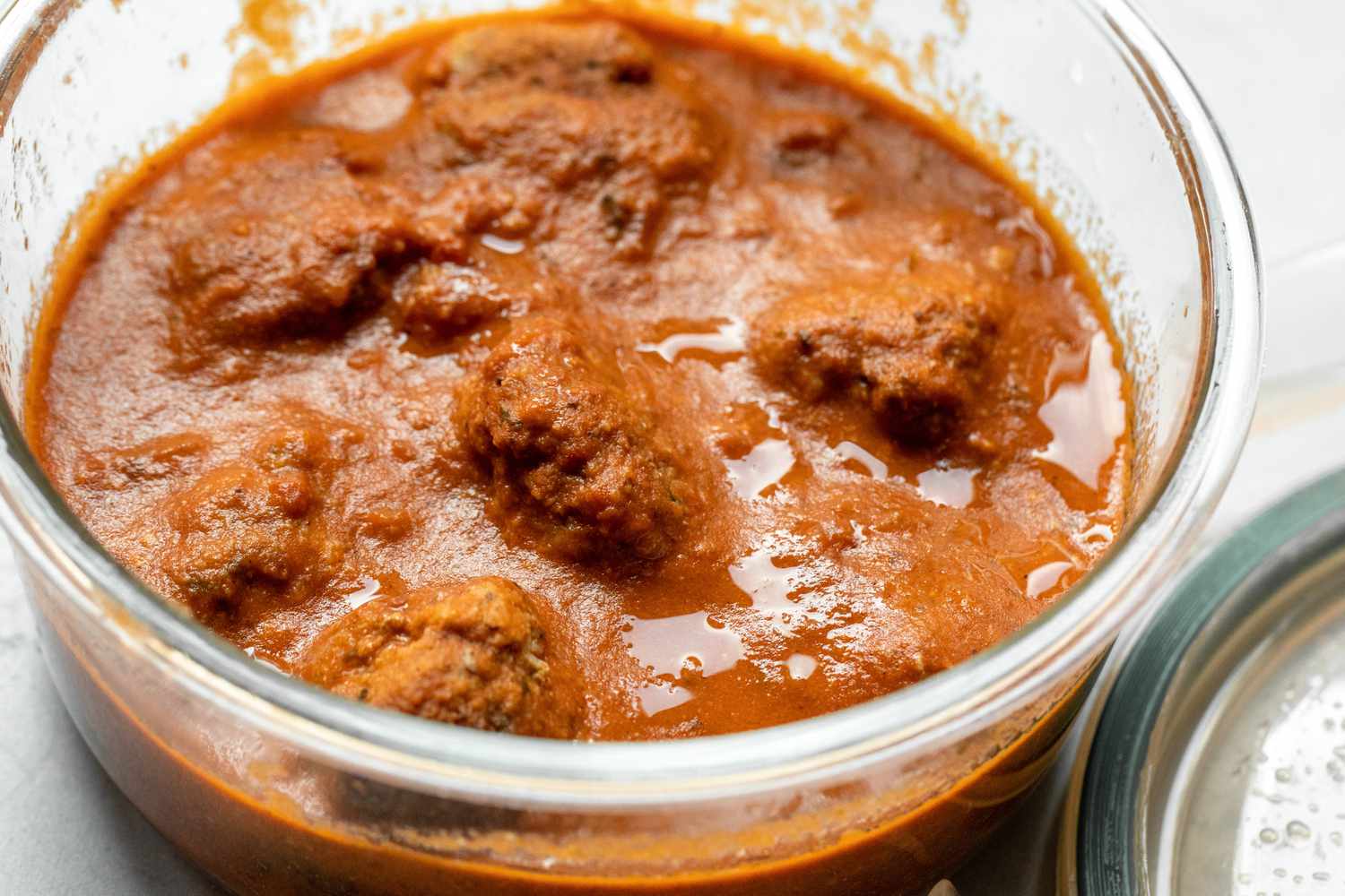 Leftover Meatballs and Marinara Sauce in a Glass Pyrex Tupperware 