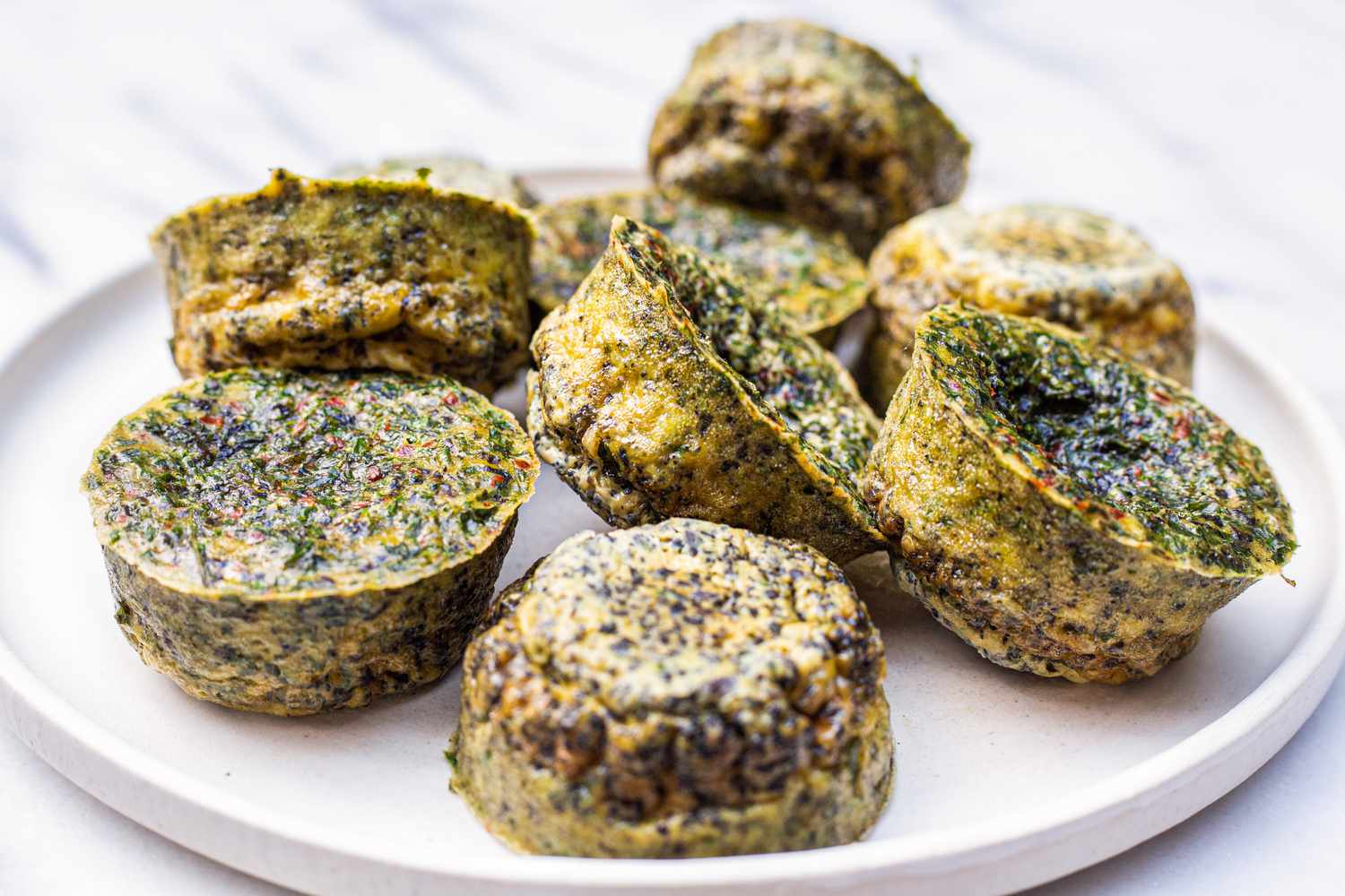 Pile of Kale and Portobello Egg Bites on a Plate