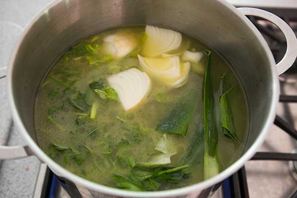Vegetables cooking in water for chicken stock