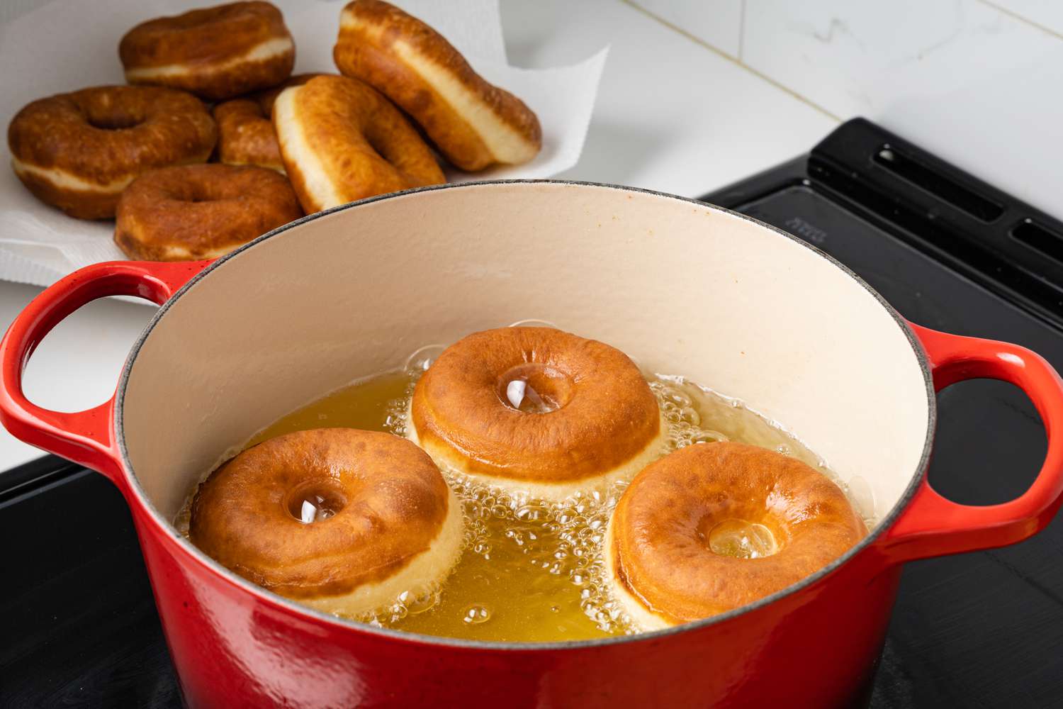 Donuts Flipped and Frying in the Dutch Oven with Oil 