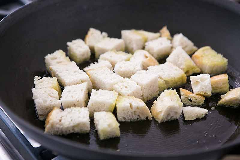 Croutons toasting in a skillet